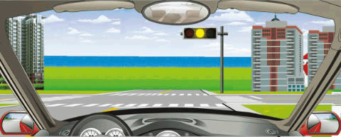 在路口直行看到图中所示信号灯亮时，要尽快加速通过路口，不得停车等待。